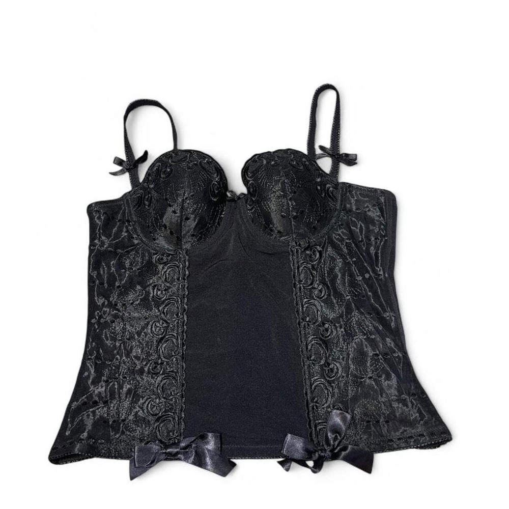 Black corset top lingerie with lace detailing and bows